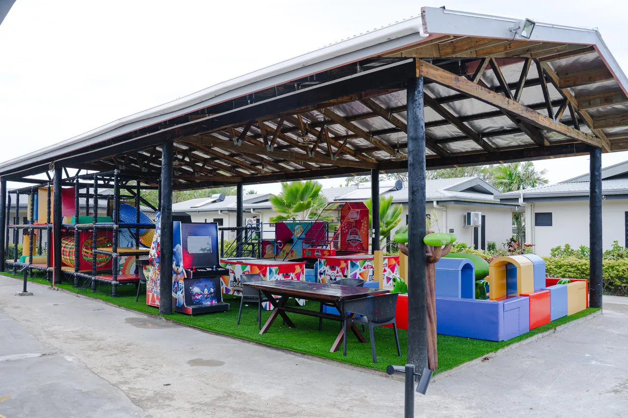 The covered Kids Playland with colourful play equipment and games